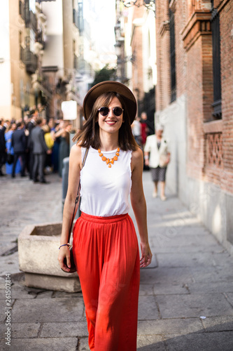 young model walking among the crowd