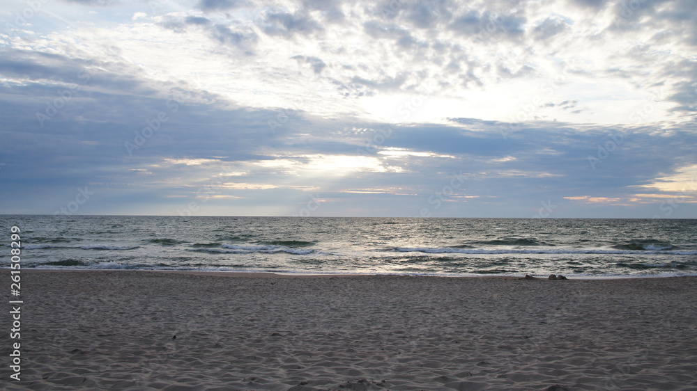 Summer evening sunny sunset in the sea on the shore. Summer evening sunny sunset in the sea on the shore.