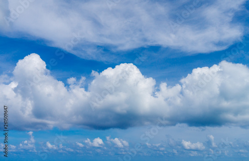 White Fluffy Clouds on Blue Sky Background © tuulijumala