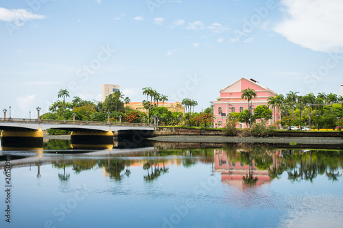 Recife, Brazil - Circa April 2019: Bridge and a view of the historic neighborhood Santo Antonio reflecting on the waters of the Capibaribe river
