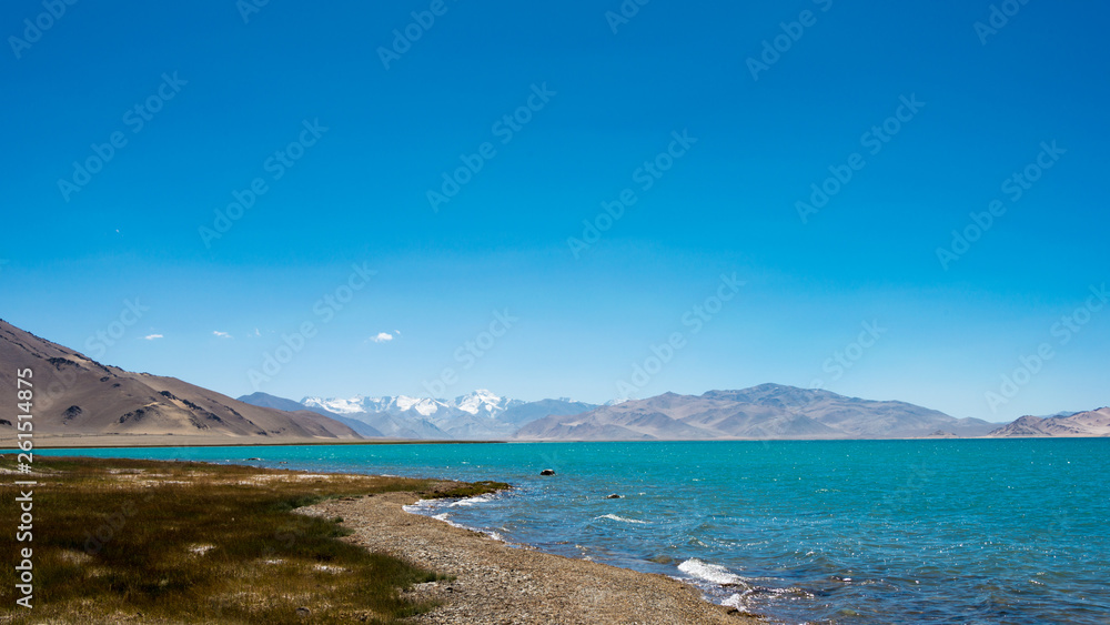 Pamir Mountains, Tajikistan - Aug 20 2018: Karakul Lake in Gorno-Badakhshan, Tajikistan. It is located in the World Heritage Site Tajik National Park (Mountains of the Pamirs).