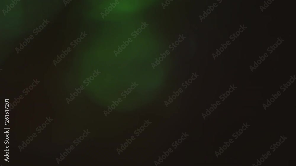 Defocused green psychedelic light spots shines chaotic in dark room. Creative transitions, natural bokeh. 4k footage. Defocused green psychedelic light spots shines chaotic in dark room. Creative transitions, natural bokeh. 4k footage.