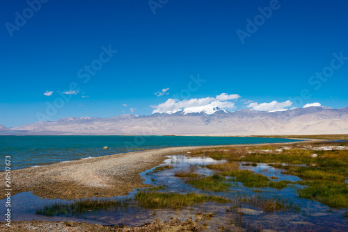 Pamir Mountains, Tajikistan - Aug 20 2018: Karakul Lake in Gorno-Badakhshan, Tajikistan. It is located in the World Heritage Site Tajik National Park (Mountains of the Pamirs).
