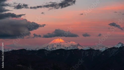sunset sun illuminates the top of Mount Elbrus, timelapse