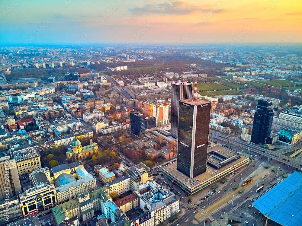 WARSAW, POLAND - APRIL 07, 2019: Beautiful panoramic aerial drone view to the center of Warsaw City in the sunset time in spring