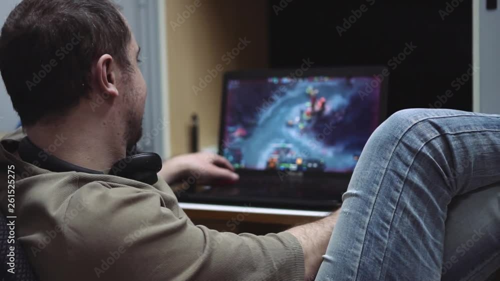 the guy is playing a computer the guy is playing a computer