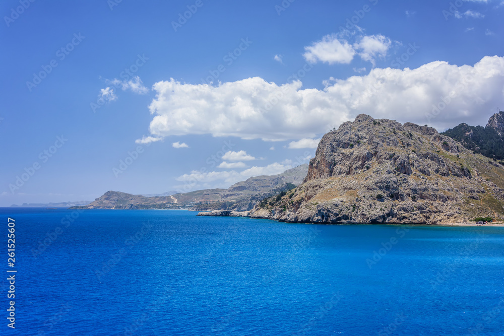 Kolymbia beaches with the rocky coast and bright sea in Rhodes island, Greece. Kolymbia beaches with the rocky coast and bright sea in Rhodes island, Greece.