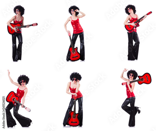 Woman in afro wig playing guitar 