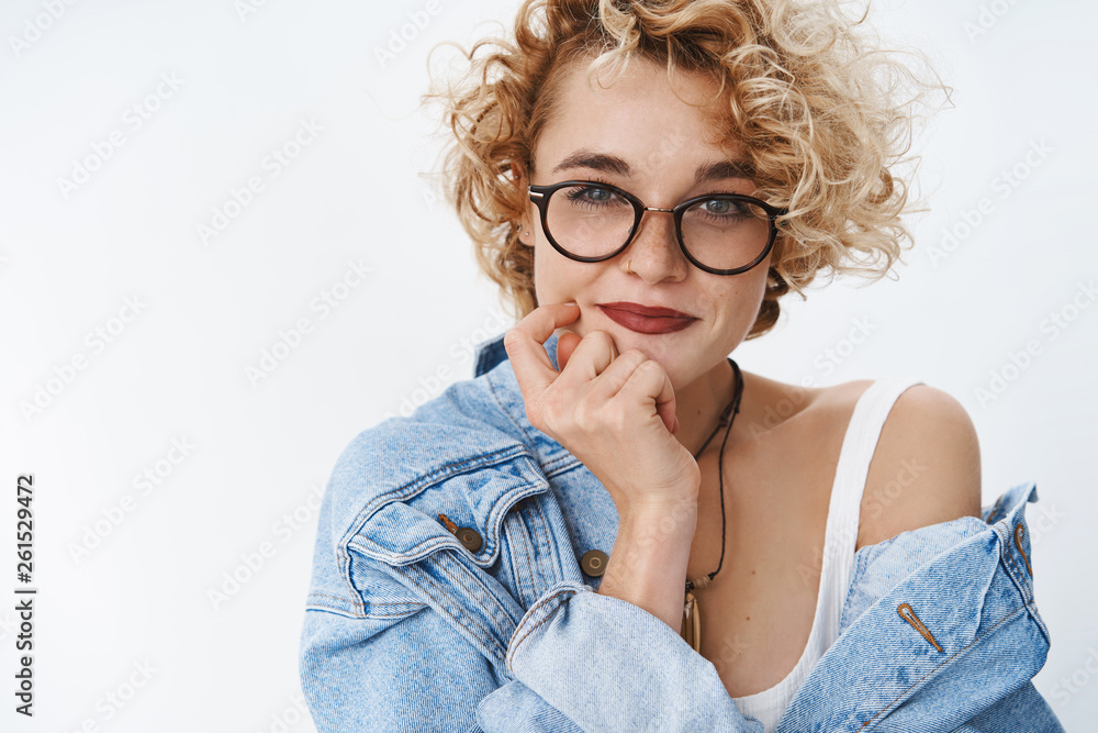 I got excellent idea. Portrait of creative and confident good-looking european female blogger in glasses and denim jacket holding hand on cheek and chin smirking delighted, having plan thinking I got excellent idea. Portrait of creative and confident good-looking european female blogger in glasses and denim jacket holding hand on cheek and chin smirking delighted, having plan thinking