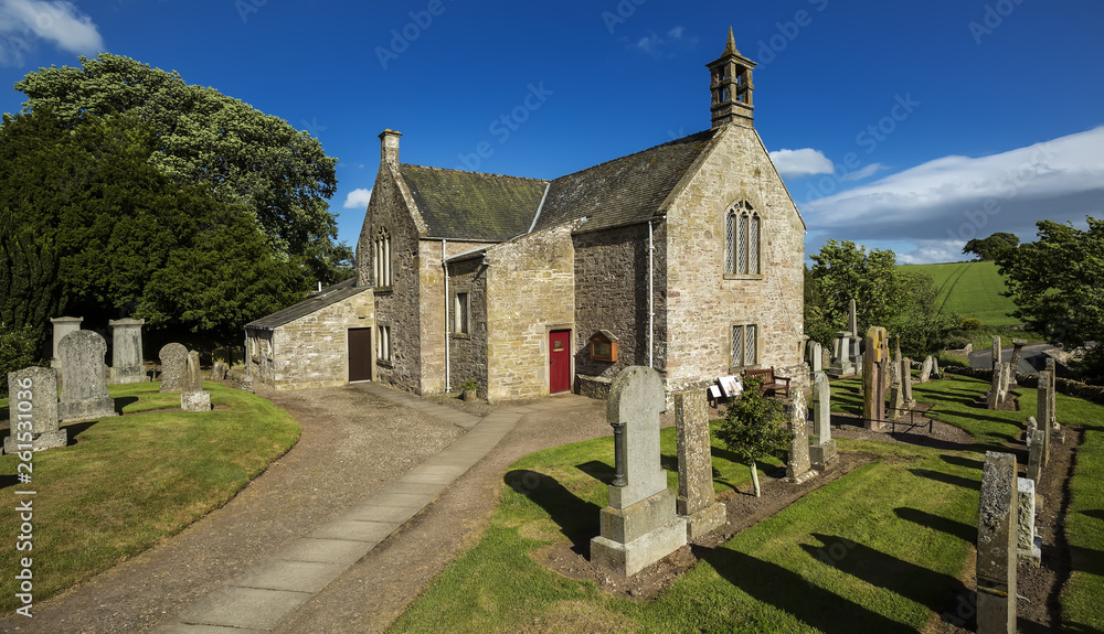 Fototapeta premium A view of the graveyard and church building in Aberlemno in Angus, Scotland.