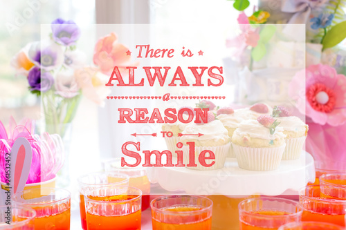 There is always a reason to smile with dessert table with cupcakes and flowers