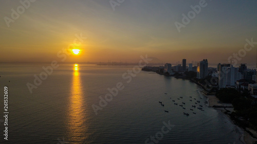Fototapeta Naklejka Na Ścianę i Meble -  Beautiful aerial sunrise near the beach in Penang Malaysia early in the morning