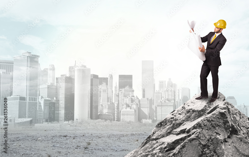 Young architect looking to ruined city from distance and thinking about investments
Young architect looking to ruined city from distance and thinking about investments