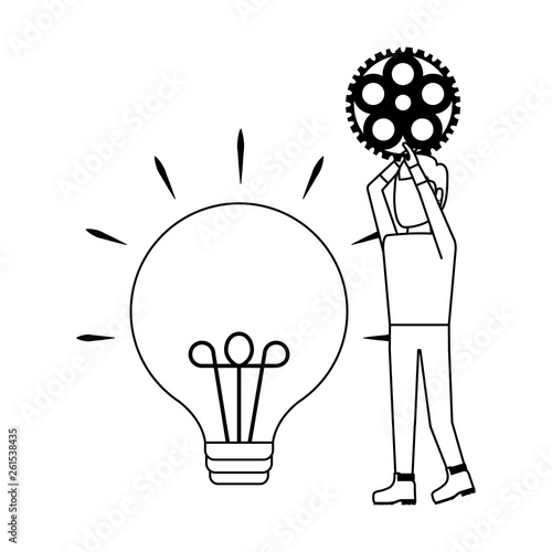 young man with gear pinion and light bulb