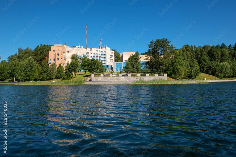 Building on the shore of a forest lake on a summer day