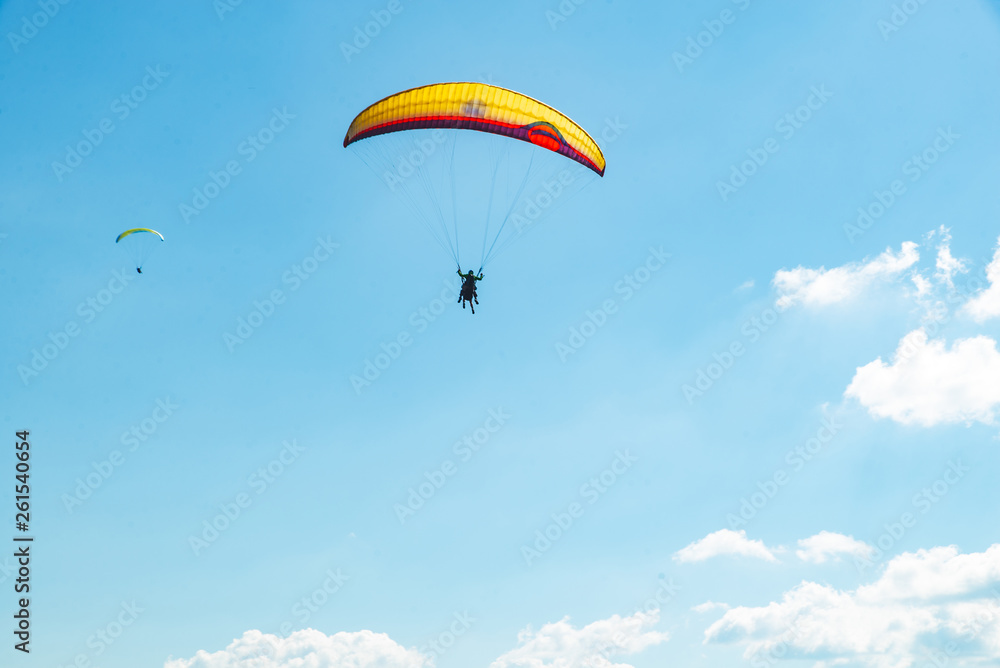 mountains leisure activities. paragliding. summer time mountains leisure activities. paragliding. summer time