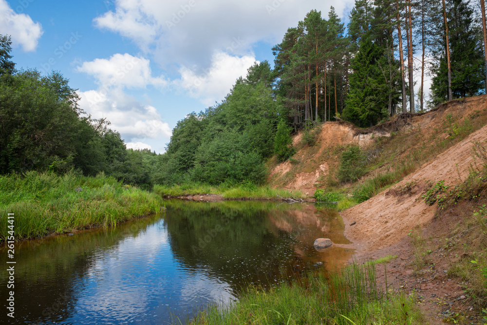 High sandy bank of the Polomet River, Novgorod Region, Russia High sandy bank of the Polomet River, Novgorod Region, Russia