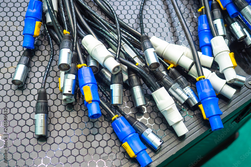 Lots of power cables. Power cords from the mains. Electrical plugs ...