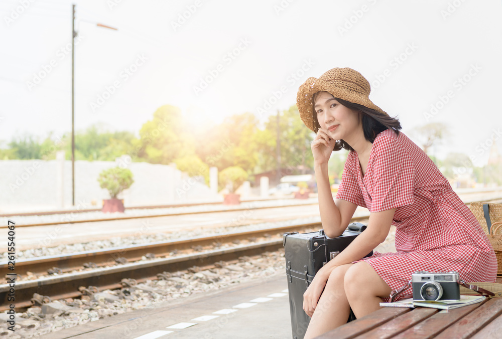 Hipster teen traveler with vintage baggage