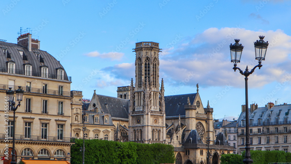 Church and historic buildings on a street of Paris France