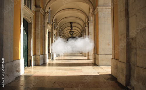 Arcade of a building with a floating cloud © nvphoto