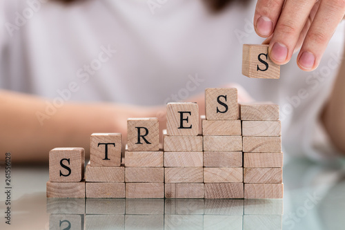 Person's Hand Placing Last Alphabet Of Word Stress