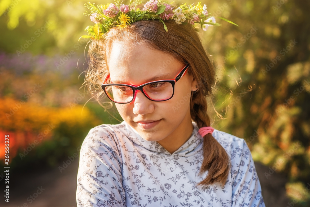 Funny teenage girl with glasses in a summer Park. Funny teenage girl with glasses in a summer Park.