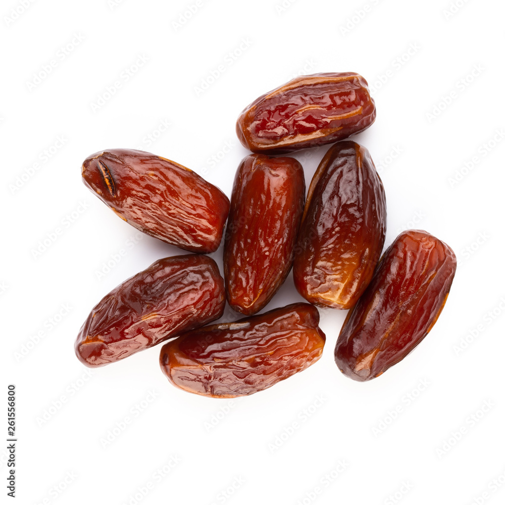 Dry dates isolated on white background. Top view. Flat lay pattern. Dry dates isolated on white background. Top view. Flat lay pattern.