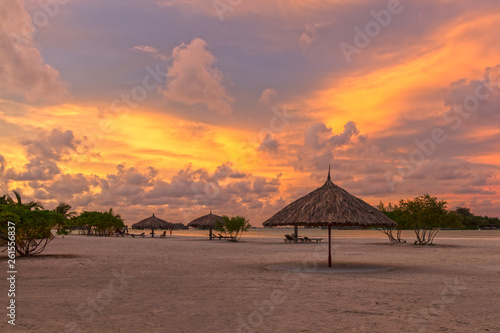 Shack on the Beach with Golden Cloudy Sky  Maldives