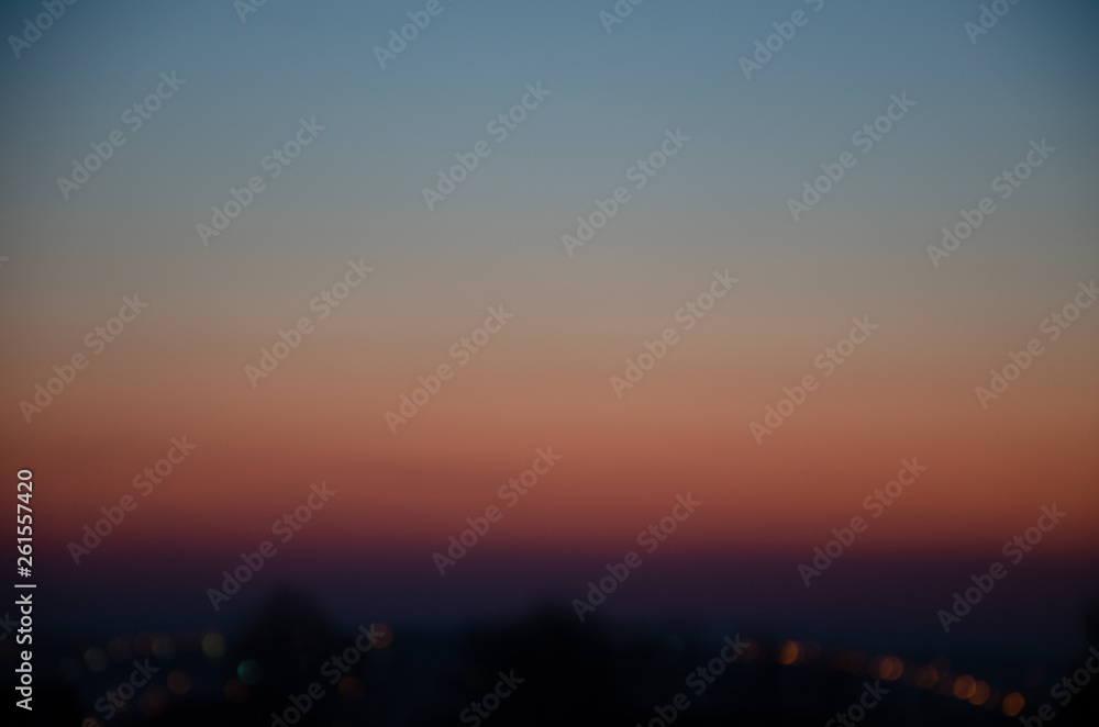 Naklejka premium Incredible, beautiful, Bright sunset over the city. Gradient, the core of the sun. Beautiful sunset, red, orange