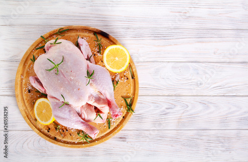 Raw chicken with lemon  rosemary and spices