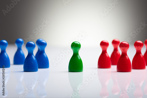 Colorful Pawns On The Reflective Desk