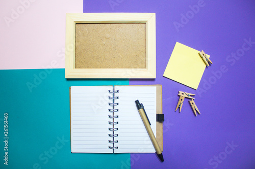 Organize with To Do List book and sticky note on background