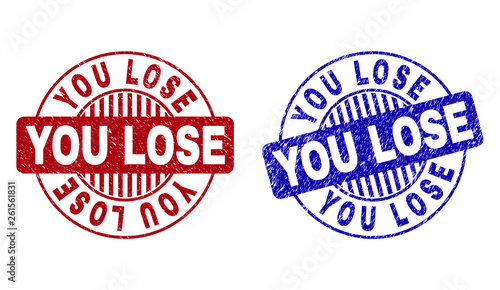 Grunge YOU LOSE round stamp seals isolated on a white background. Round seals with grunge texture in red and blue colors. Vector rubber overlay of YOU LOSE label inside circle form with stripes.