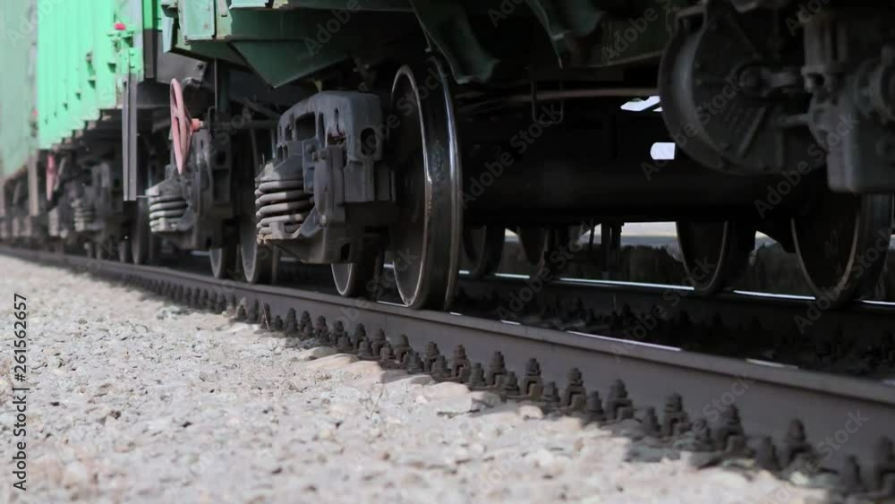 The wheels of old train on the railway track passing by camera. Close up shot The wheels of old train on the railway track passing by camera. Close up shot