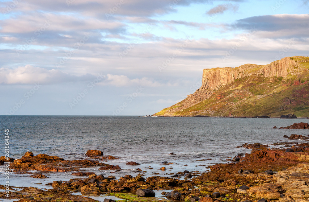 Famous Fair Head cliff on the Northern coast of County Antrim, Northern Ireland, UK. Sunset light