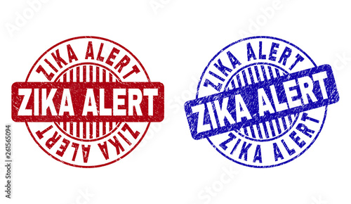 Grunge ZIKA ALERT round stamp seals isolated on a white background. Round seals with grunge texture in red and blue colors. Vector rubber watermark of ZIKA ALERT text inside circle form with stripes.