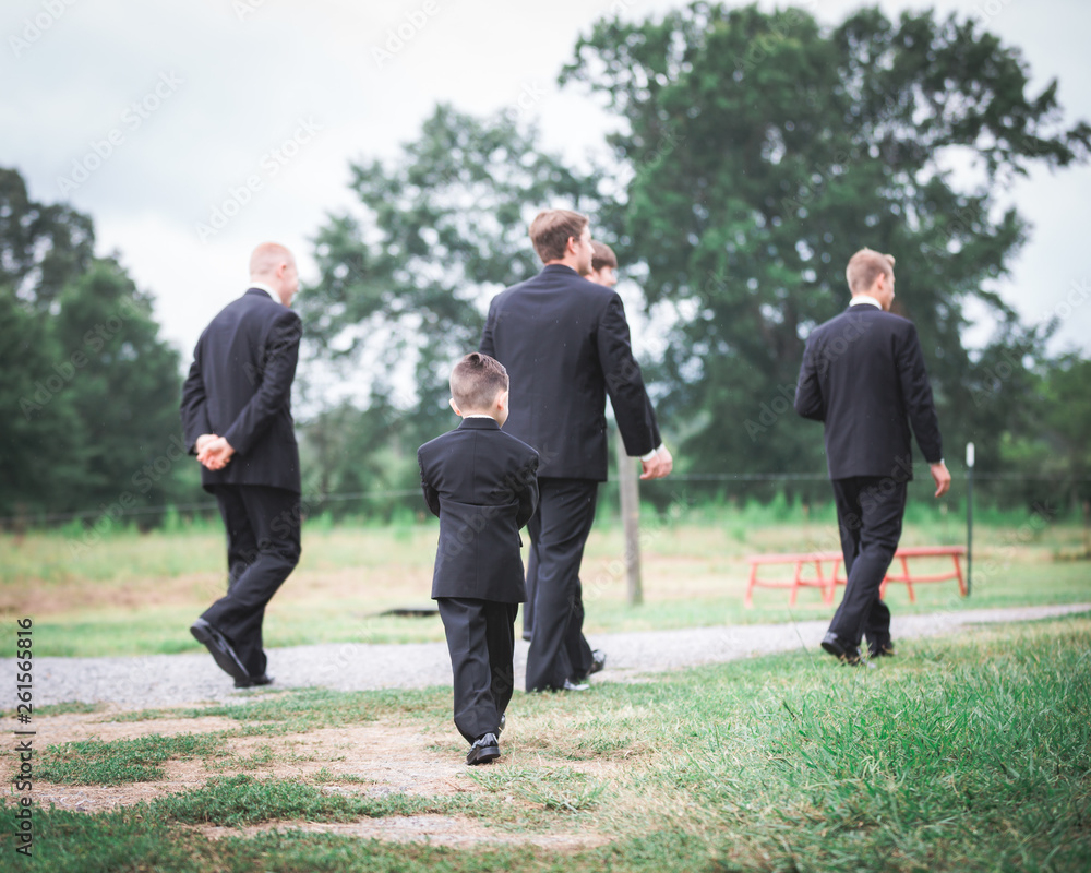 Wedding party walking away from camera Wedding party walking away from camera