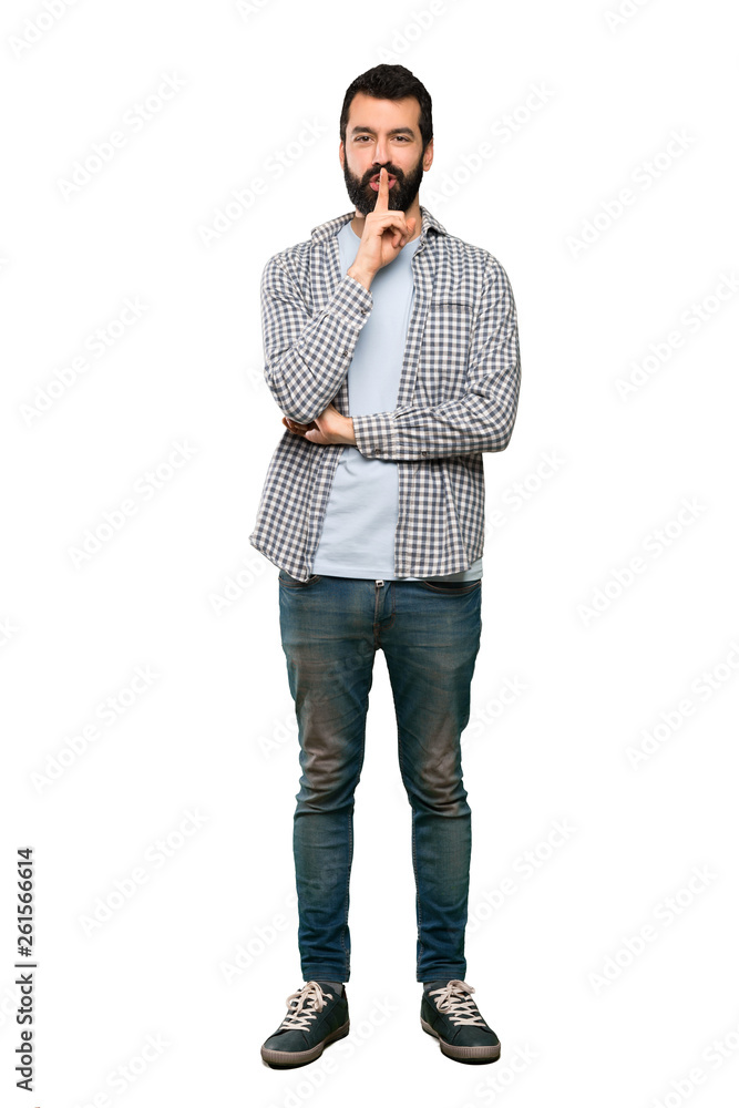 Handsome man with beard showing a sign of silence gesture putting finger in mouth over isolated white background Handsome man with beard showing a sign of silence gesture putting finger in mouth over isolated white background