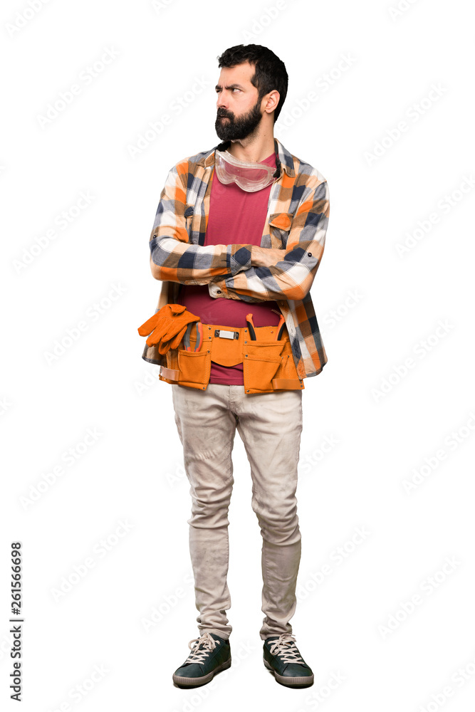 Craftsmen man with confuse face expression over isolated white background Craftsmen man with confuse face expression over isolated white background