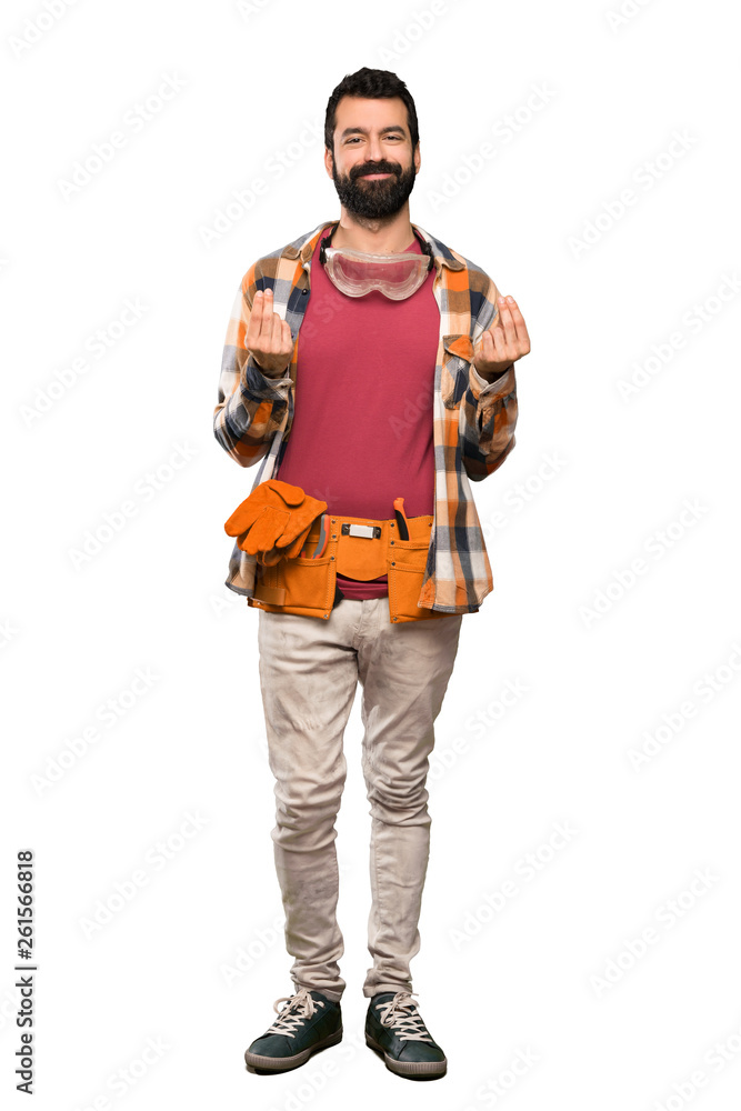 Craftsmen man making money gesture over isolated white background Craftsmen man making money gesture over isolated white background
