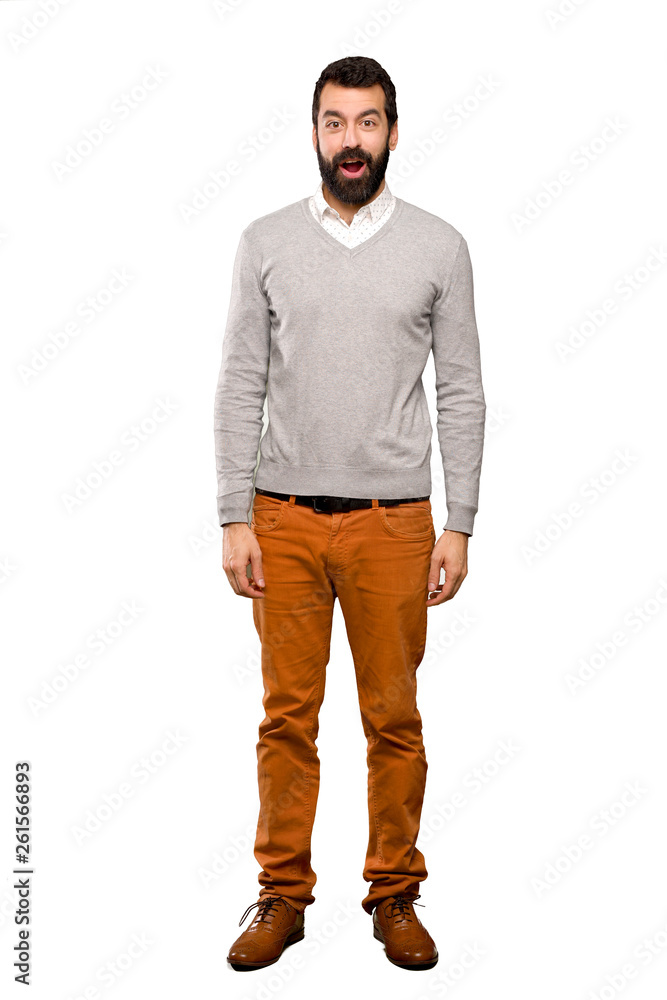 Fototapeta premium Handsome man with surprise facial expression over isolated white background