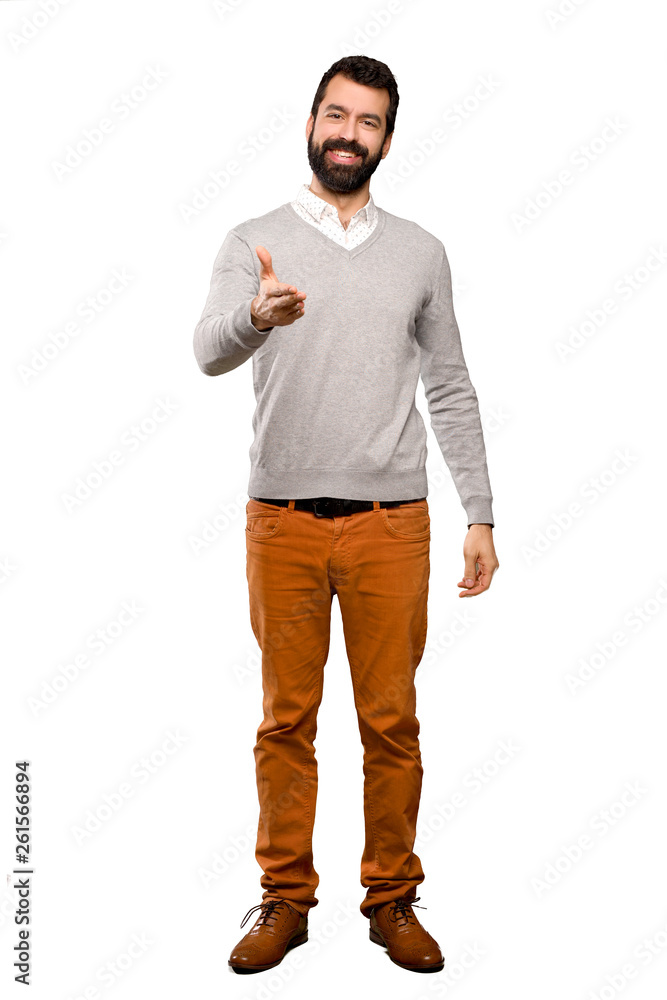 Fototapeta premium Handsome man shaking hands for closing a good deal over isolated white background