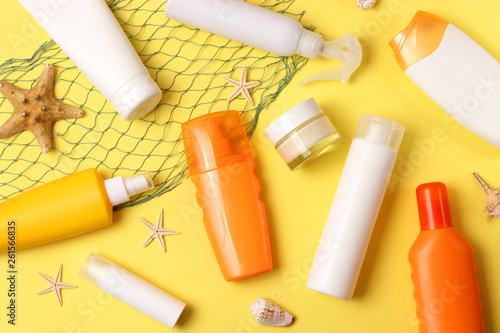  seashells and sunscreen on a colored background top view. Sunscreen