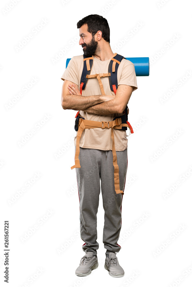 Hiker man in lateral position over isolated white background Hiker man in lateral position over isolated white background