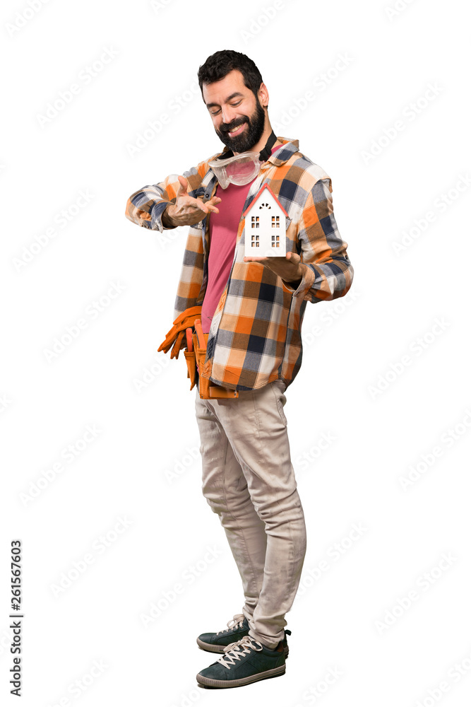 Craftsmen man holding a little house Craftsmen man holding a little house