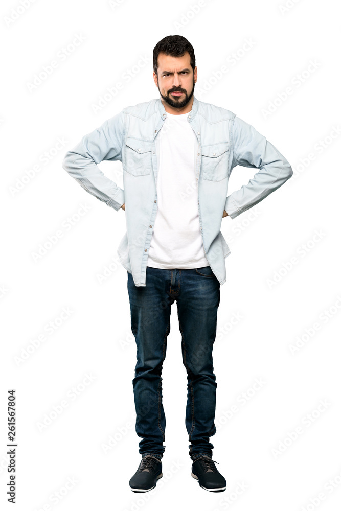 Full-length shot of Handsome man with beard angry over isolated white background Full-length shot of Handsome man with beard angry over isolated white background