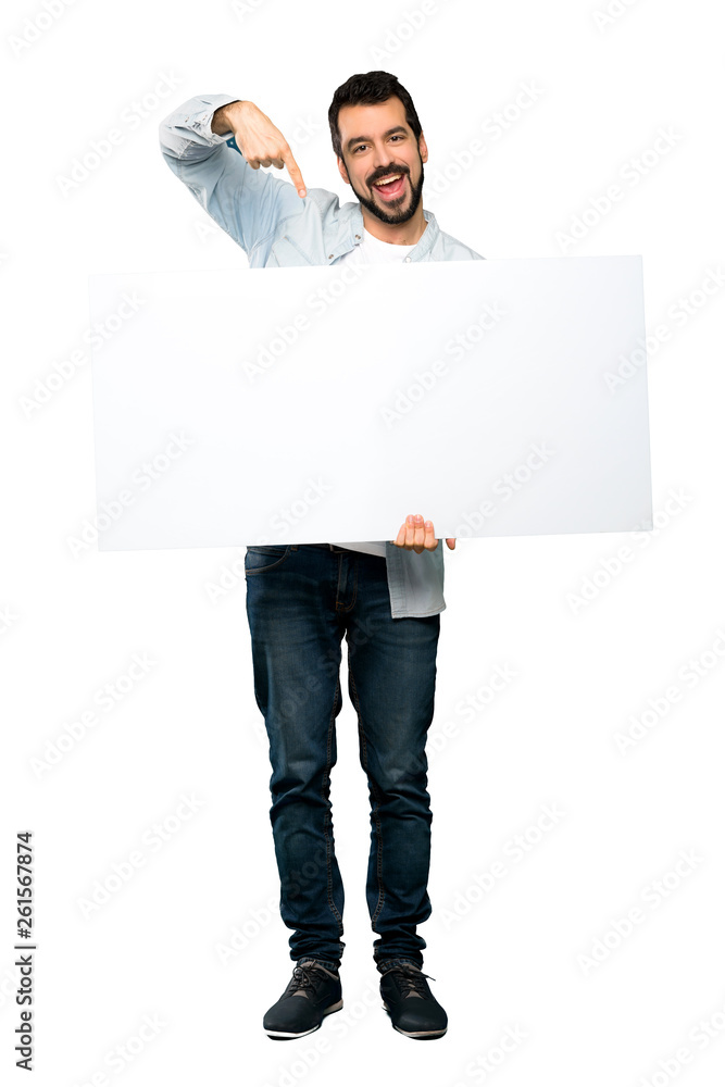 Handsome man with beard holding an empty placard Handsome man with beard holding an empty placard