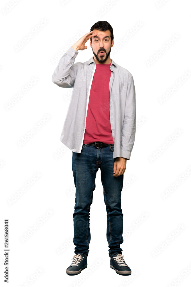 Full-length shot of Handsome man with beard has just realized something and has intending the solution over isolated white background Full-length shot of Handsome man with beard has just realized something and has intending the solution over isolated white background