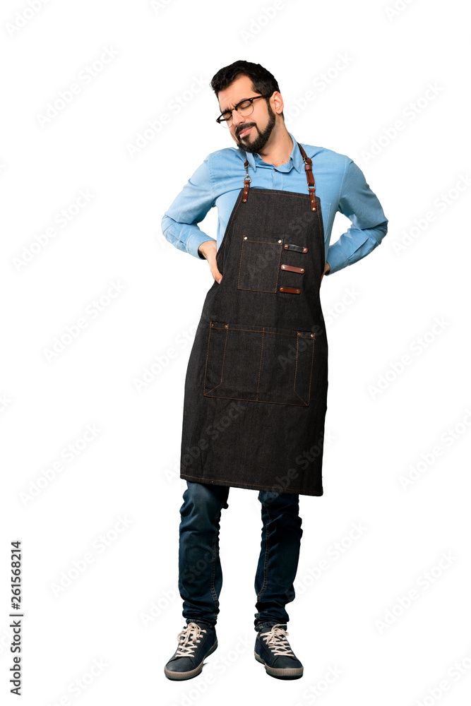 Full-length shot of Man with apron suffering from backache for having made an effort over isolated white background Full-length shot of Man with apron suffering from backache for having made an effort over isolated white background